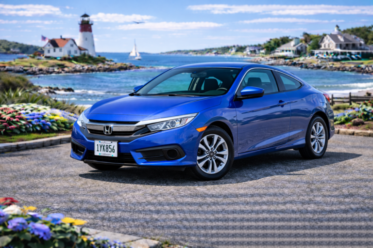Blue Honda Civic rental from Vachon in Cranston, RI, shown with a lighthouse and coastal backdrop
