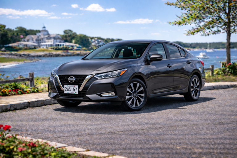 Black Nissan Sentra rental from Vachon in Cranston, RI, shown with a waterfront backdrop